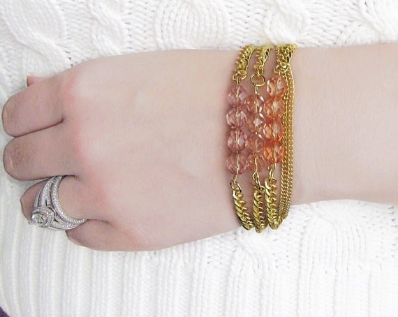 Bead Bracelet Stack In Transparent Shades Of Pink On Gold Chain